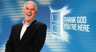 Thank God You're Here - previous host Shane Bourne