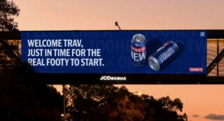 Tooheys out of home billboard by Thinkerbell inviting Travis Kelce to real footys as he touches down in Sydney for Taylor Swift concert